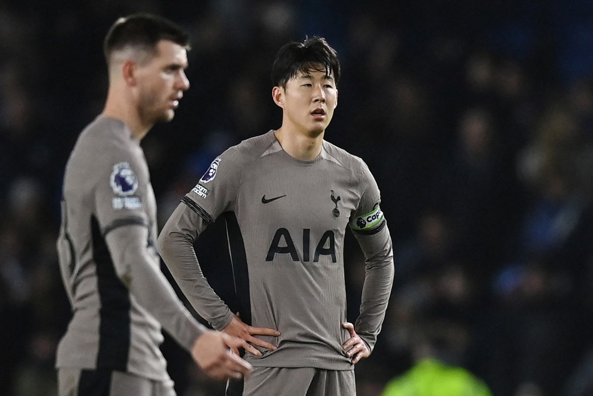 Tottenham Hotspur's South Korean striker #07 Son Heung-Min (R) reacts at the end of the English Premier League football match between Brighton and Hove Albion and Tottenham Hotspur at the American Express Community Stadium in Brighton, southern England on December 28, 2023. Photo by Glyn KIRK / AFP