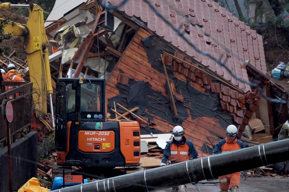Rescuers search for missing victims at a landslide site in the Kawashima district in the city of Anamizu, Ishikawa Prefecture, on January 6, 2024. (Photo by Toshifumi Kitamura / AFP)