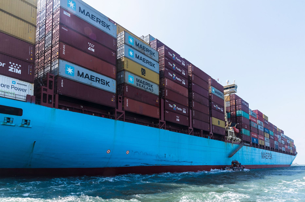 A side view of a fully loaded cargo container ship, owned by the Maersk Line, in the Red Sea.