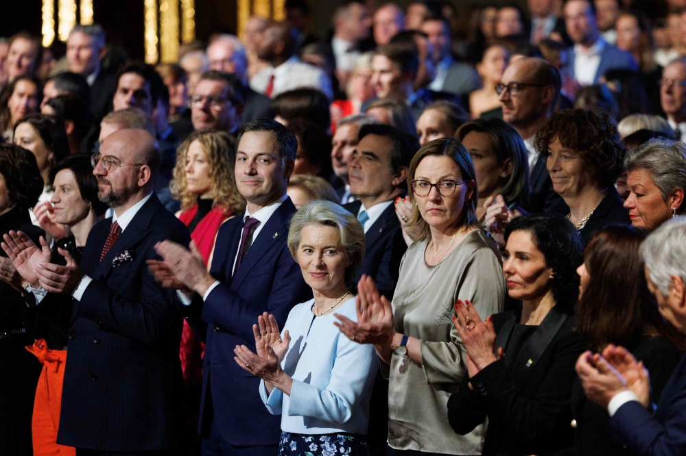 European Council President Charles Michel (L), Belgium Prime Minister Alexander De Croo (2L) and European Commission President Ursula Von der Leyen (C) applaud during the opening event of the Belgian Presidency of the Council of the European Union at the Bozar centre in Brussels, on January 5, 2024. Photo by Benoit DOPPAGNE / various sources / AFP