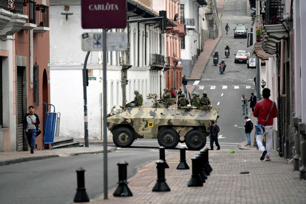 Ecuadorean security forces patrol the area around the main square and presidential palace after Ecuadorean President Daniel Noboa declared the country in a state of 