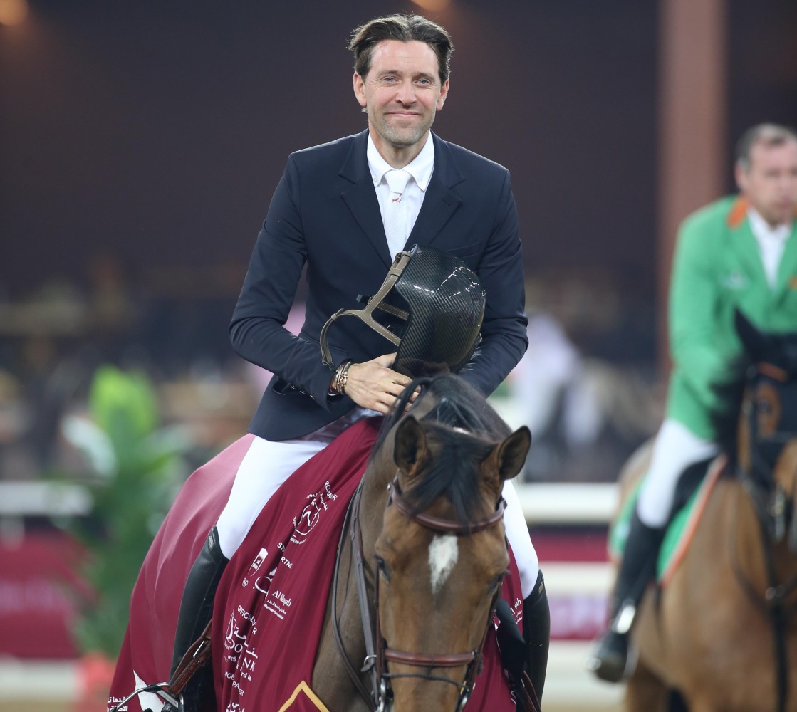French rider Simon Delestre riding Olga van de Kruishoeve celebrates after his victory. 