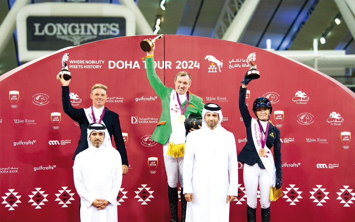 President of the Qatar Equestrian Federation (QEF) Bader Al Darwish, and Chairman of Doha Tour’s Supreme Organising Committee and QEF Secretary General Sheikh Ahmad bin Nooh Al Thani with podium winners of 1.55m CSI4*event.   