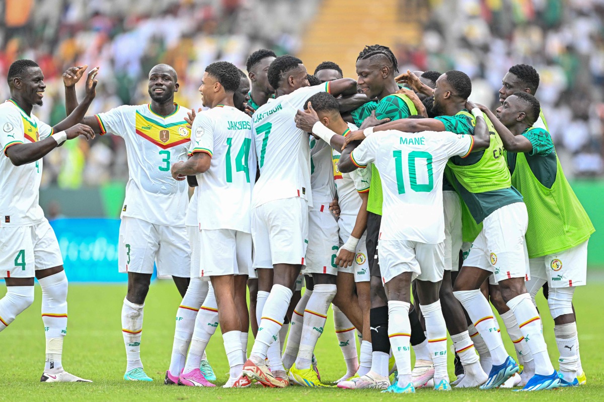 Senegal's players celebrates scoring their team's third goal during the Africa Cup of Nations (CAN) 2024 group C football match between Senegal and Gambia at Stade Charles Konan Banny in Yamoussoukro on January 15, 2024. (Photo by Issouf SANOGO / AFP)

