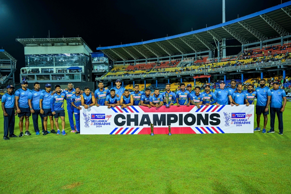 Sri Lanka's players pose with the series trophy after winning the third and final Twenty20 international cricket match between Sri Lanka and Zimbabwe at the R. Premadasa Stadium in Colombo on January 18, 2024. (Photo by Ishara S. KODIKARA / AFP)

