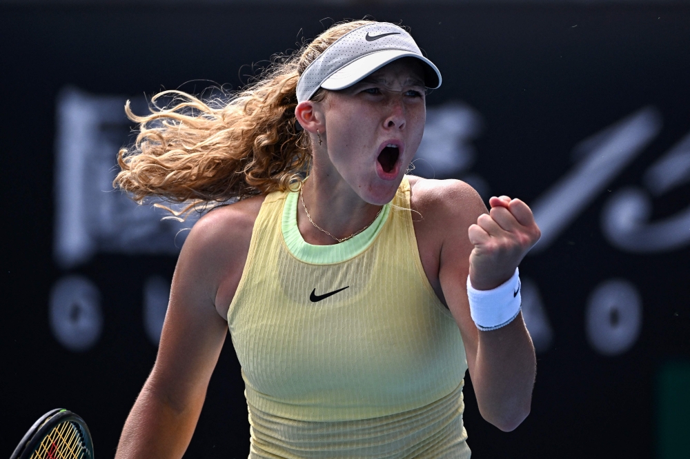 Russia's Mirra Andreeva reacts after a point against France's Diane Parry during their women's singles match on day six of the Australian Open tennis tournament in Melbourne on January 19, 2024. (Photo by Lillian SUWANRUMPHA / AFP) 