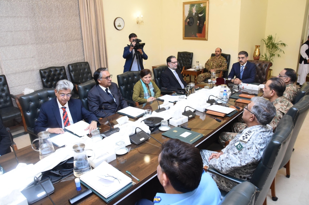 In this handout photograph taken and released by the Pakistan's Press Information Department (PID) on January 19, 2024, Pakistan's Prime Minister Anwar-ul-Haq Kakar (2ndR) chairs a National Security Committee meeting along with armed forces chiefs and other government officials in Islamabad. Pakistan and Iran 