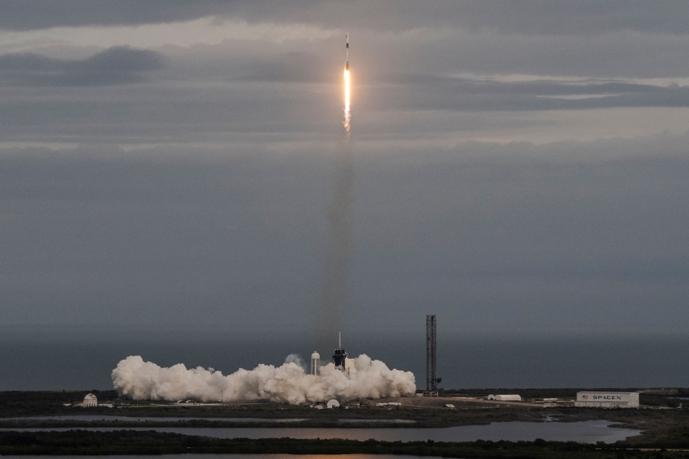 A SpaceX Falcon 9 rocket with its Crew Dragon capsule launches from pad LC-39A during Axiom Mission Three (Ax-3) at the Kennedy Space Center, in Cape Canaveral, Florida, on January 18, 2024. (Photo by Chandan Khanna / AFP)