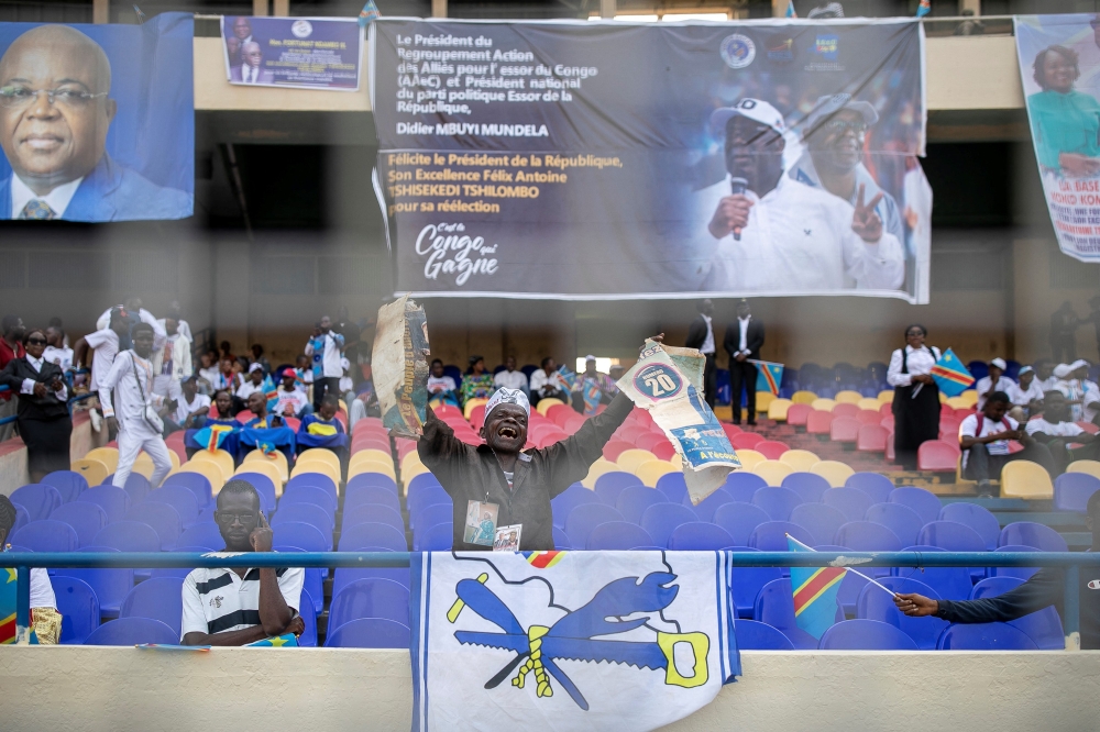 Supporters of the President of the Democratic Republic of Congo, Felix Tshisekedi, gather ahead of his inauguration at Stade de Martyrs in Kinshasa on January 20, 2024. (Photo by Arsene MPIANA MONKWE / AFP)
