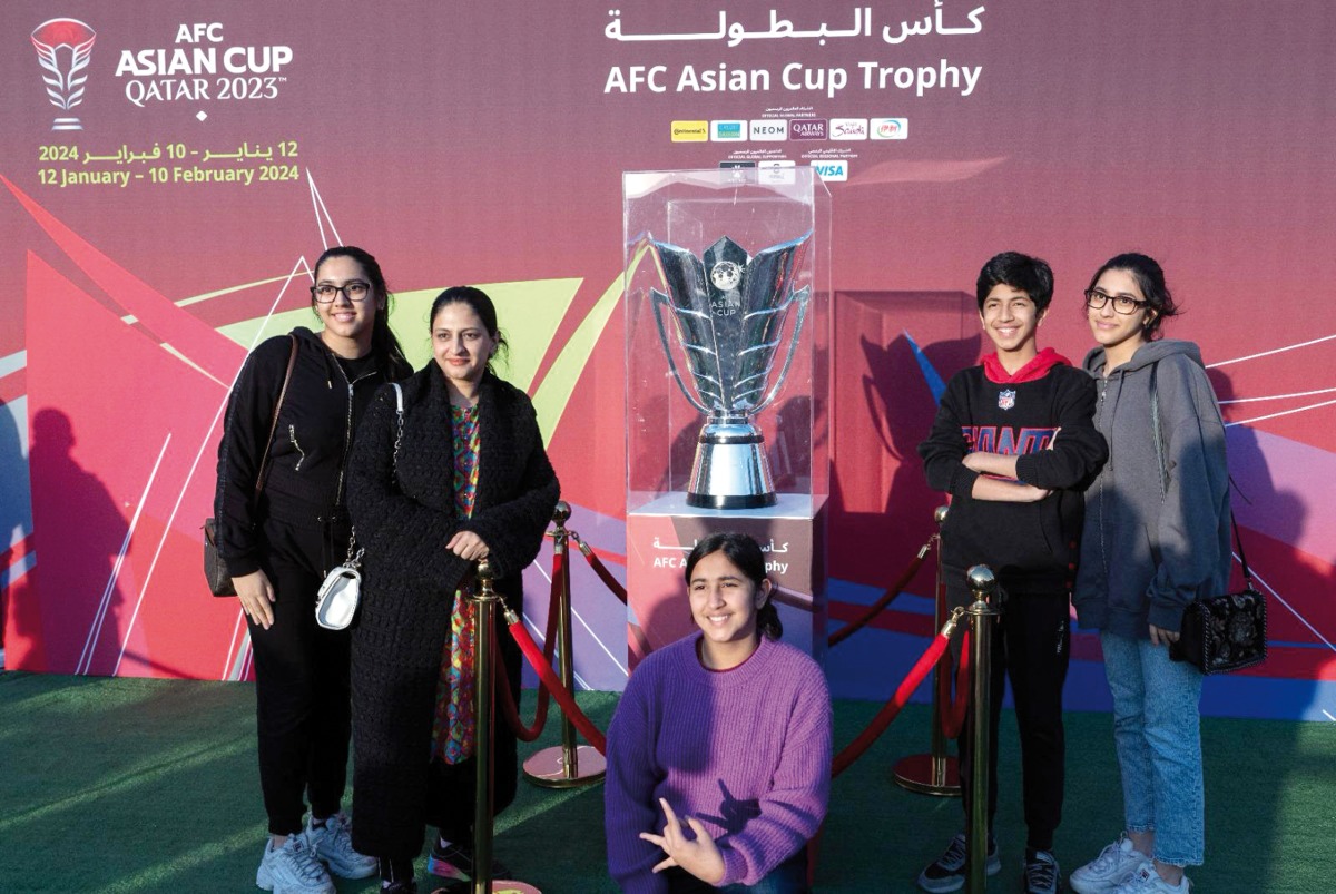 Visitors with the AFC Asian Cup trophy.
