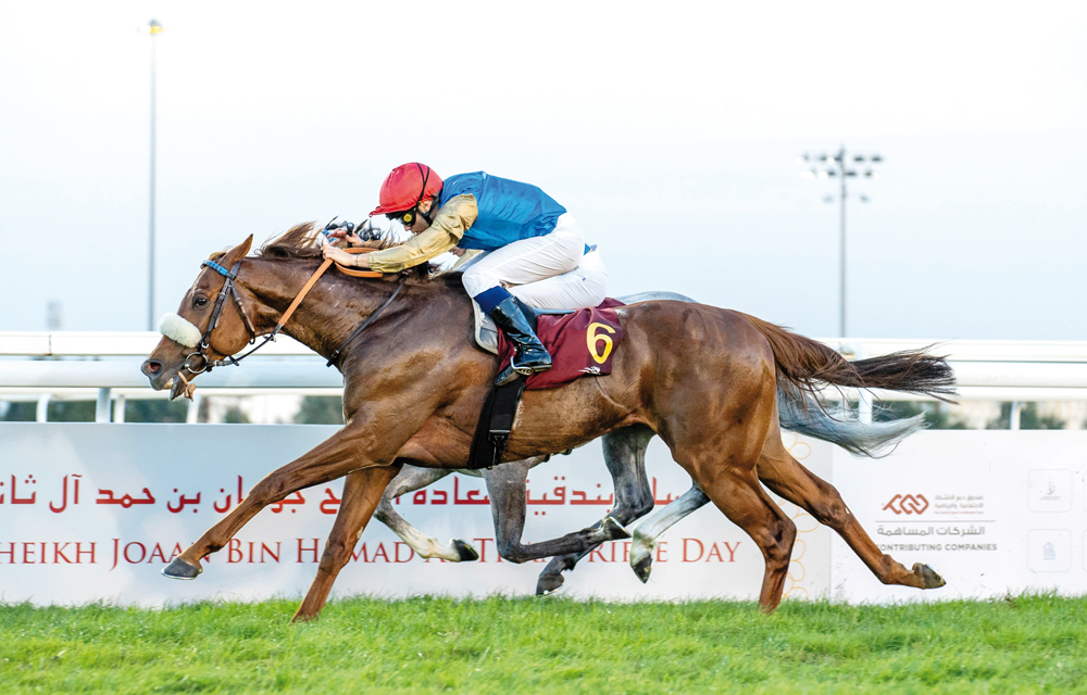 Simca Mille, with jockey Mickael Barzalona in the saddle, crosses the finish line to win the H E Sheikh Joaan Bin Hamad Al Thani Rifle, Thoroughbreds event.
