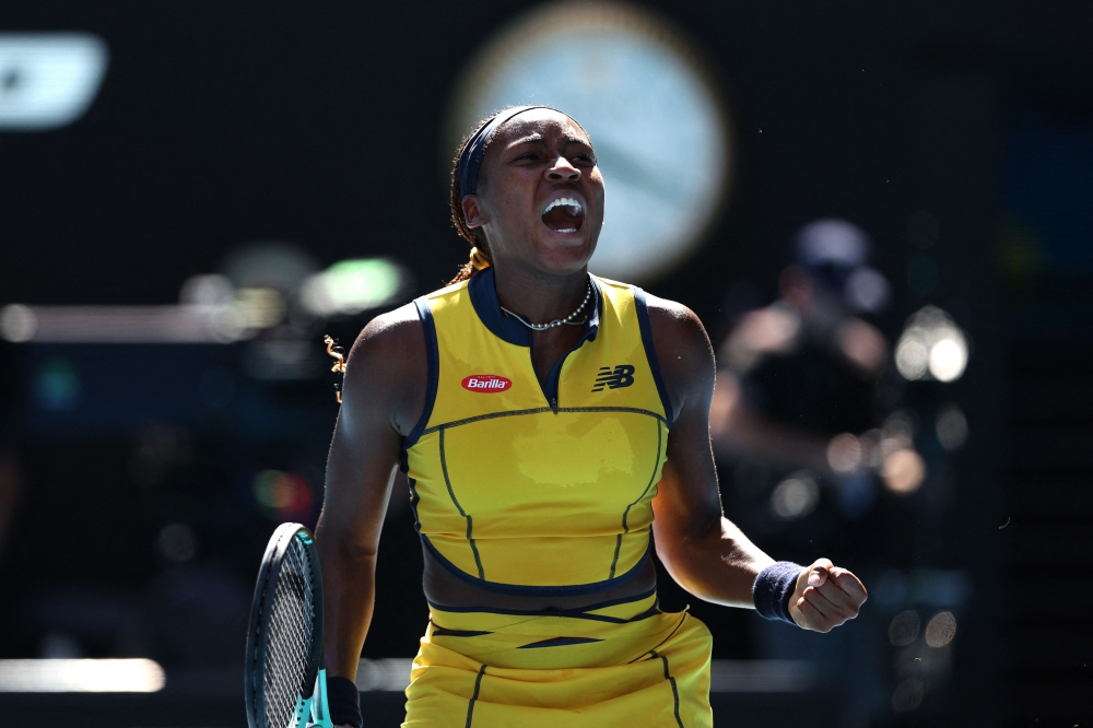 USA's Coco Gauff celebrates the match point against Ukraine's Marta Kostyuk during their women's singles quarter-final match in Melbourne on January 23, 2024. (Photo by Martin Keep / AFP)