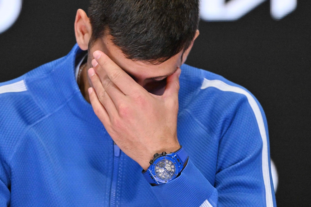 Serbia's Novak Djokovic attends a press conference after losing against Italy's Jannik Sinner on January 26, 2024. (Photo by Saeed Khan / AFP)