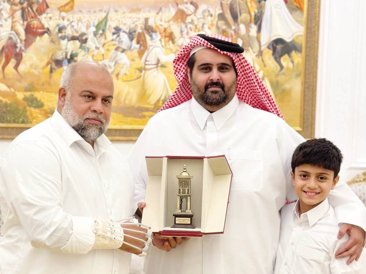 Director of Media Development Department at Qatar Media Corporation, Sheikh Khalid bin Abdulaziz Al Thani (centre) with Al Jazeera journalist Wael Al Dahdouh.
