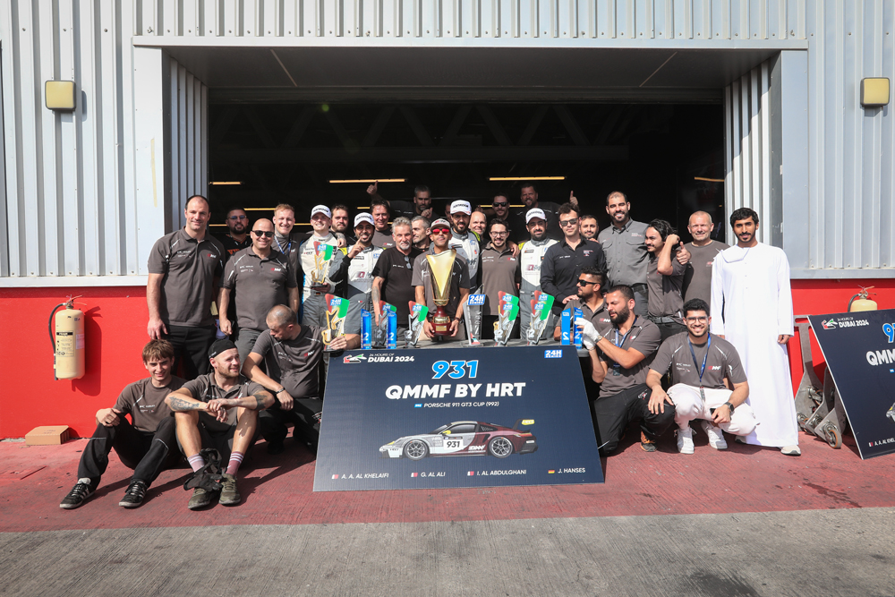 Team QMMF's drivers and officials celebrate after the title win. 