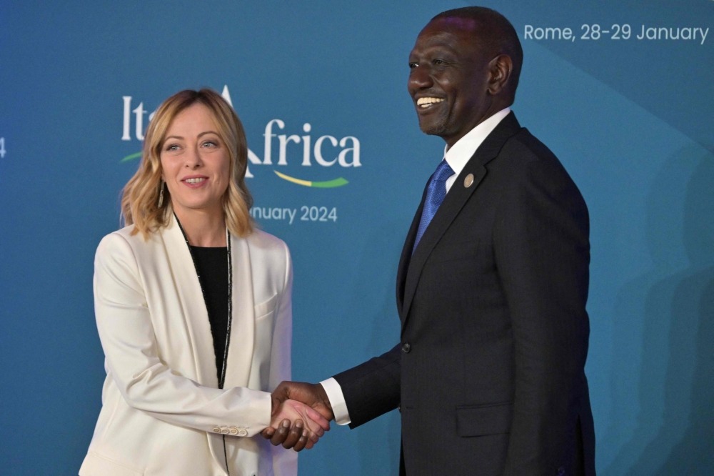 Italy's Prime Minister, Giorgia Meloni welcomes William Samoei Ruto, President of Kenya as he arrives for the Italy-Africa international conference 'A bridge for common growth’ at the Italian Senate in Rome on January 29, 2024. (Photo by Andreas SOLARO / AFP)

