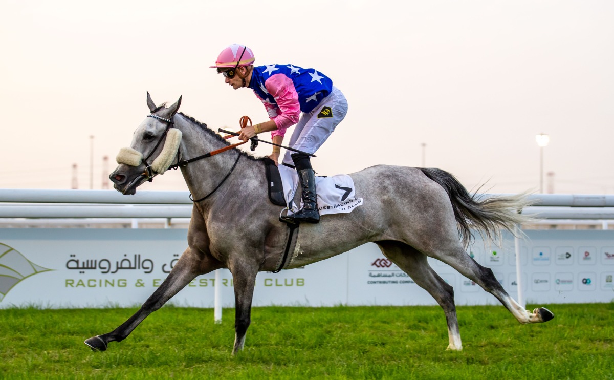 Jockey Lukas Delozier guides Talg’at Al Shahania to Al Jumail Cup victory at Al Uqda Racecourse, yesterday.