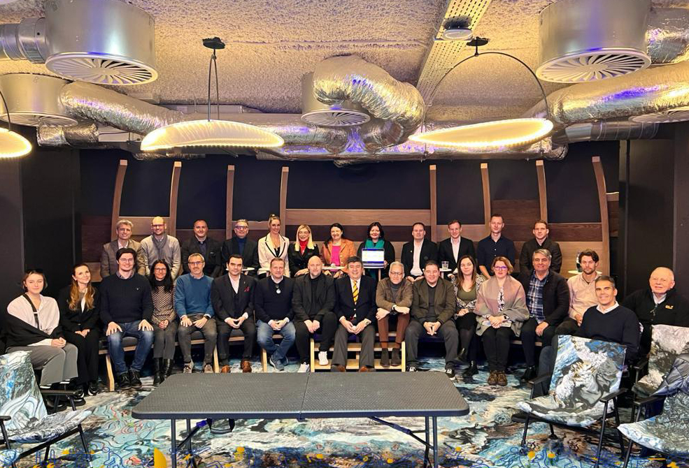Officials pose for a photo during the European Multiclub Sport Association's General Assembly held in Brussels, Belgium.