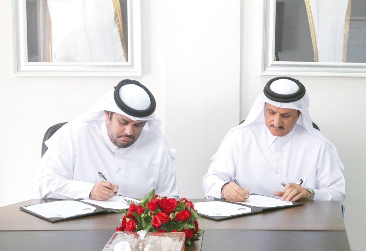 Qatar Scientific Club and Al Asmakh Charity Foundation officials signing the MoU.