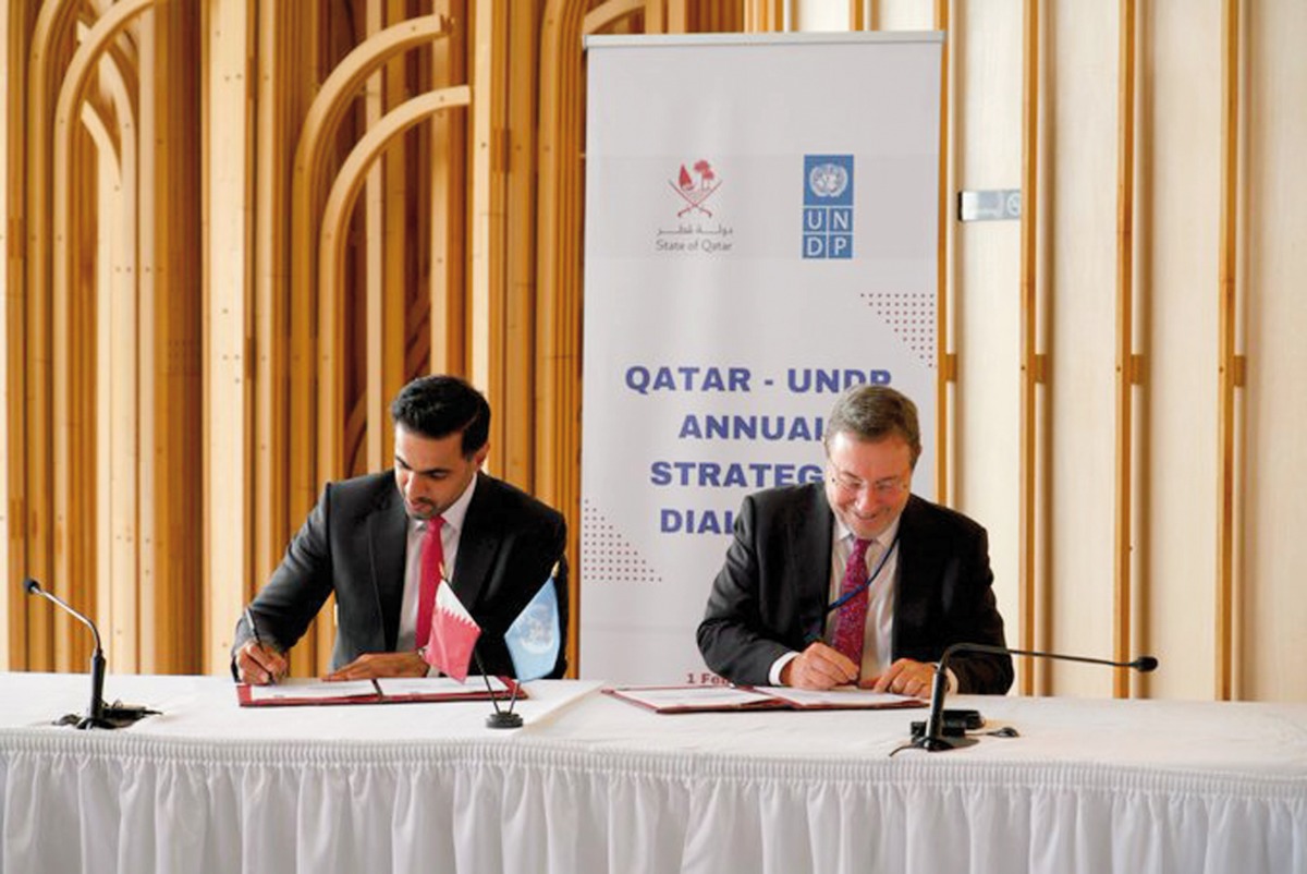 Director-General of QFFD H E Khalifa Al Kuwari (left) and UNDP Administrator Achim Steiner signing an agreement.