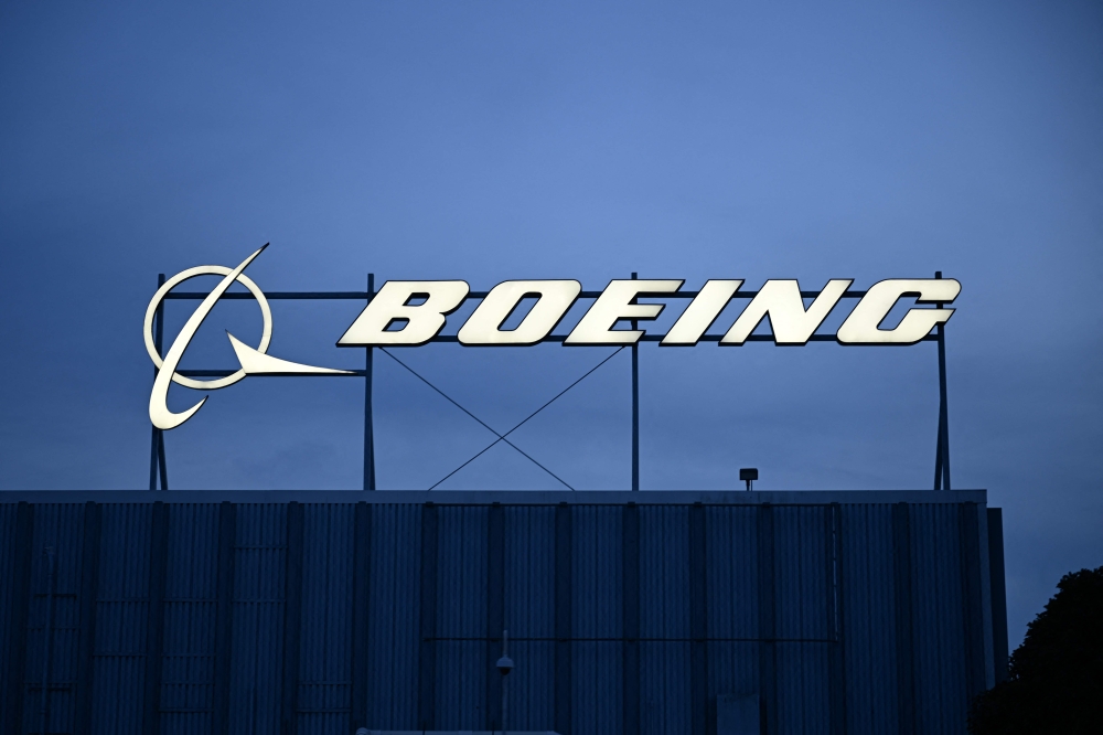 (Files) The Boeing Co. logo displayed outside company offices near Los Angeles International Airport (LAX) in El Segundo, California on January 18, 2024. (Photo by Patrick T. Fallon / AFP)
 