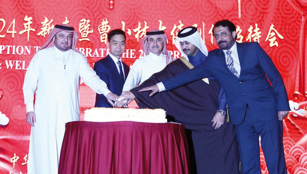 Director of Department of Protocol at the Ministry of Foreign Affairs H E Ambassador Ibrahim Fakhroo (left); Ambassador of China to Qatar H E Cao Xiaolin (second left) along with other officials during the cake-cutting ceremony.