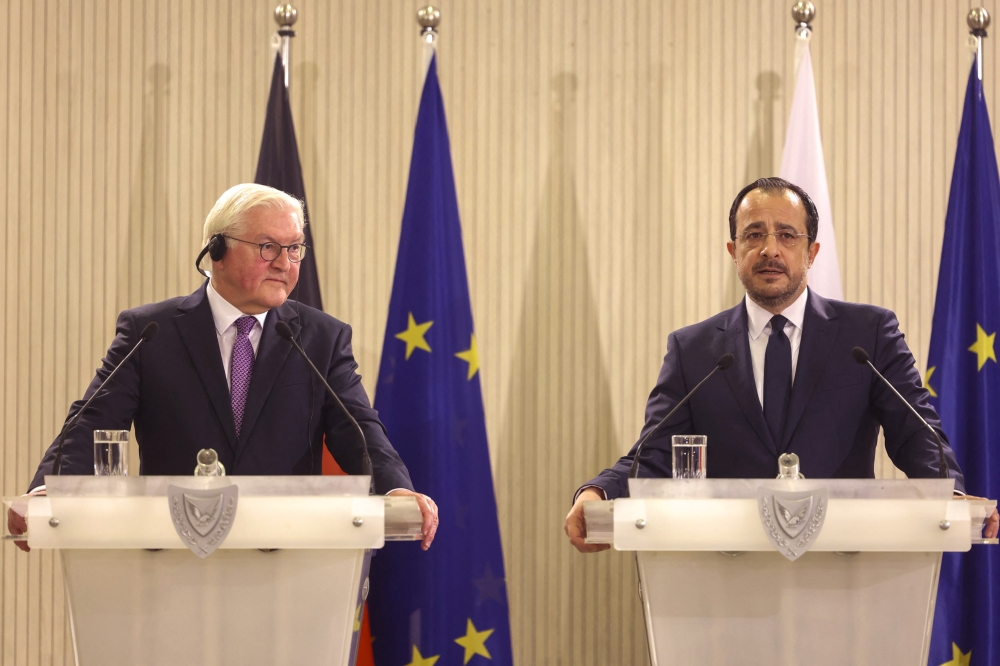 A handout picture provided by the Cyprus government's Press and Information Office (PIO) shows German President Frank-Walter Steinmeier (L) and his Cypriot counterpart Nikos Christodouludes during a joint press conference following their meeting in Nicosia on February 12, 2024. (Photo by Stavros IOANNIDES / PIO / AFP)
