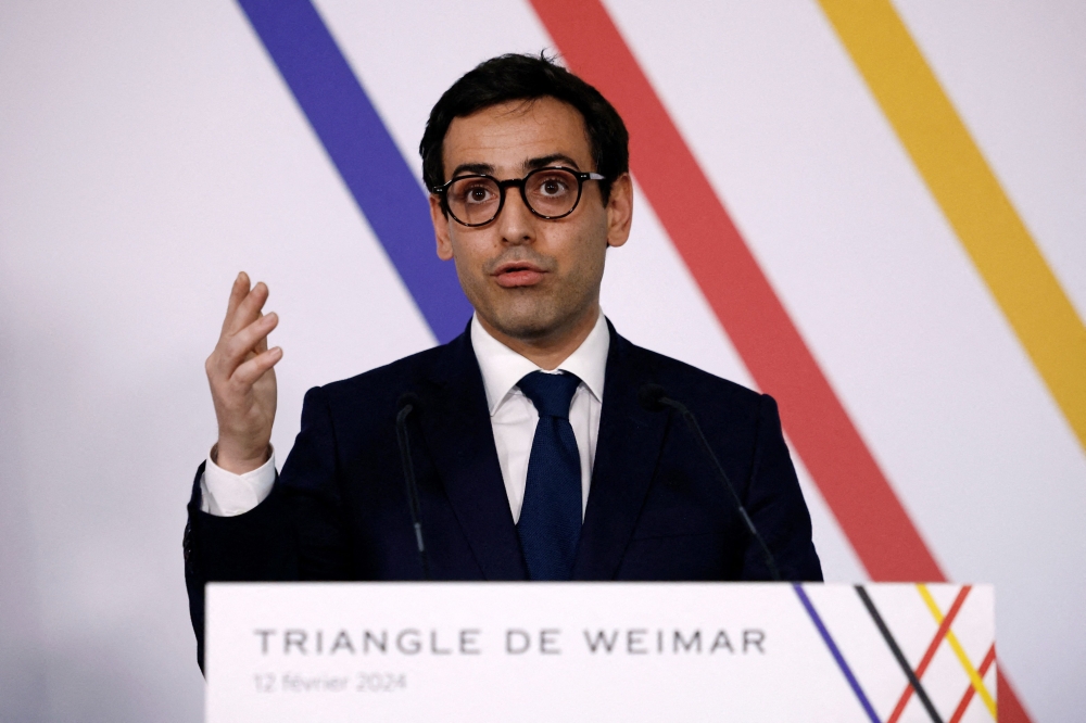 French Foreign and European Affairs Minister Stephane Sejourne speaks during a joint press conference with German Foreign Minister Annalena Baerbock (not seen) and Polish Foreign Minister Radoslaw Sikorski (not seen) after their Weimar Triangle talks at the Chateau de La Celle-Saint-Cloud, near Paris, on February 12, 2024. (Photo by SARAH MEYSSONNIER / POOL / AFP)
