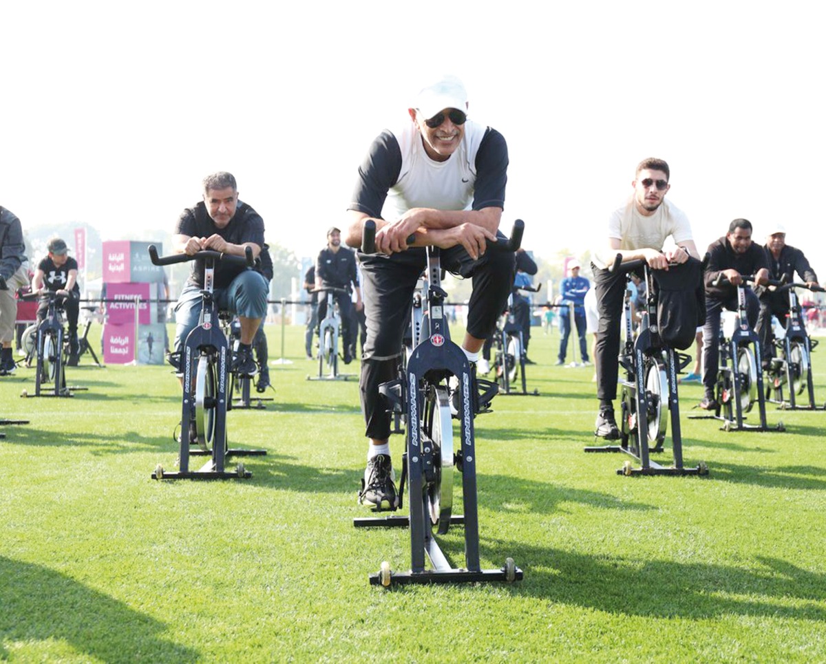 Speaker of the Council H E Hassan bin Abdullah Al Ghanim and other officials cycle during the National Sport Day activities at Aspire Park yesterday. 