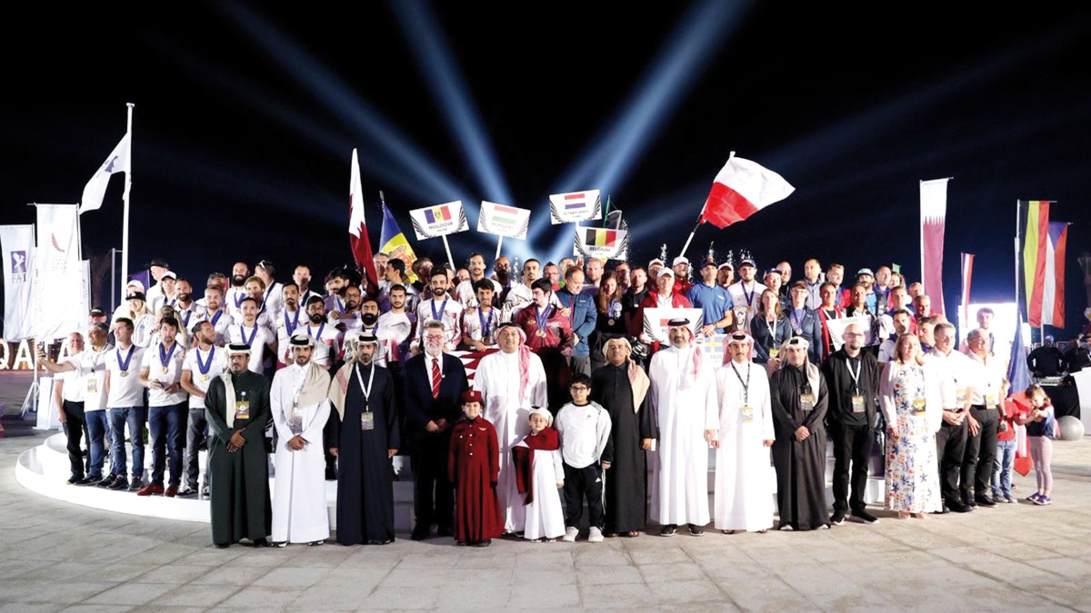 Deputy Prime Minister and Minister of State for Defense Affairs H E Dr. Khalid bin Mohammed Al Attiyah (fifth left) and other dignitaries and participants during the event.