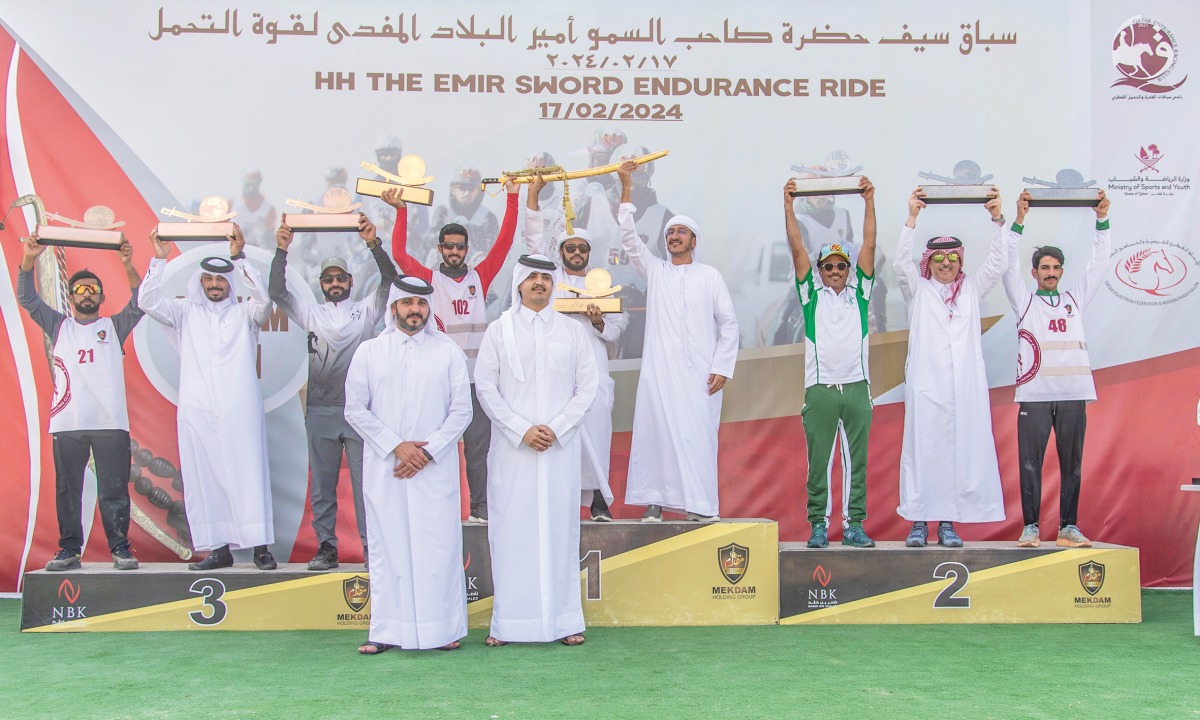 H E Sheikh Thani bin Hamad Al Thani poses for a picture with the winners of the H H the Amir Sword Endurance Ride.