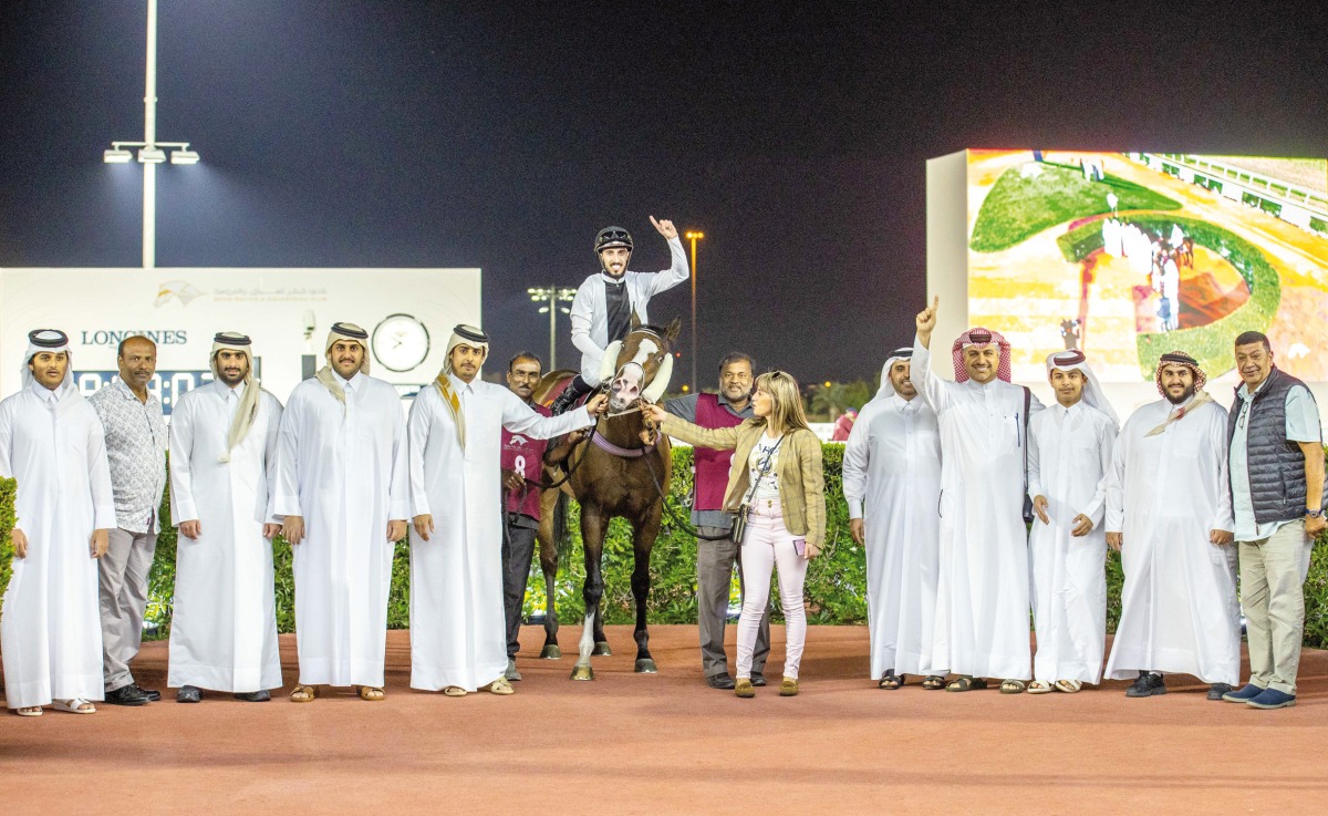 The connections of Townsend Manor celebrate after the Al Rufaa Racing-owned Townsend Manor won the Class 2 Ain Khaled Cup for Thoroughbreds at Al Rayyan Racecourse, yesterday. PICTURES: JUHAIM/QREC