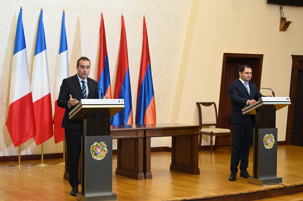French Defence Minister Sebastien Lecornu and his Armenian counterpart Suren Papikyan hold a joint press conference following their talks in Yerevan on February 23, 2024. (Photo by KAREN MINASYAN / AFP)
