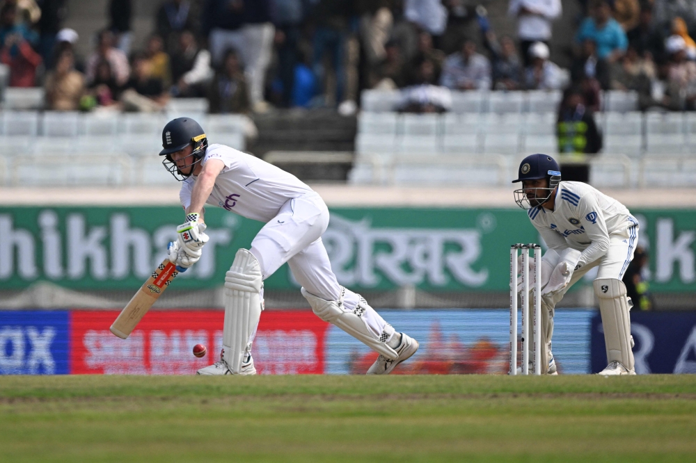 England's Zak Crawley (L) plays a shot during the third day of the fourth Test cricket match between India and England at the Jharkhand State Cricket Association (JSCA) Stadium in Ranchi on February 25, 2024. (Photo by Tauseef Mustafa / AFP) 