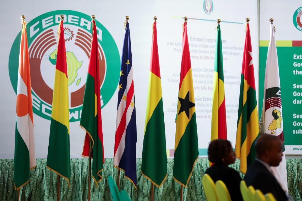 Flags of Economic Community of West African States Commission (ECOWAS) countries are displayed inside the Nigeria presidential villa, after the extraordinary session of Economic Community of West African States (ECOWAS) Heads of State and Government in Abuja, Nigeria on February 24, 2024. (Photo by Kola Sulaimon / AFP)
