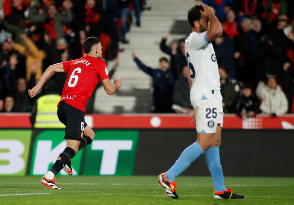 Real Mallorca's Spanish defender #06 Jose Manuel Copete celebrates scoring the opening goal during the Spanish league football match between RCD Mallorca and Girona FC at the Mallorca Son Moix stadium in Palma de Mallorca on March 3, 2024. (Photo by JAIME REINA / AFP)
