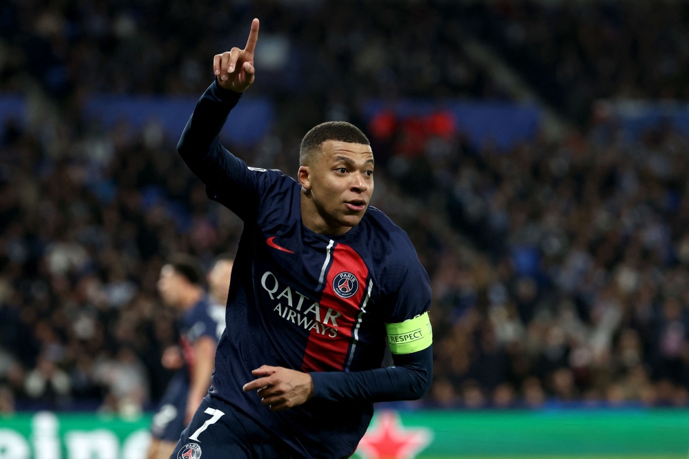 Paris Saint-Germain's French forward #07 Kylian Mbappe celebrates scoring his team's second goal during the UEFA Champions League last 16 second leg football match between Real Sociedad and Paris Saint-Germain (PSG) at the Anoeta stadium in San Sebastian on March 5, 2024. (Photo by FRANCK FIFE / AFP)
