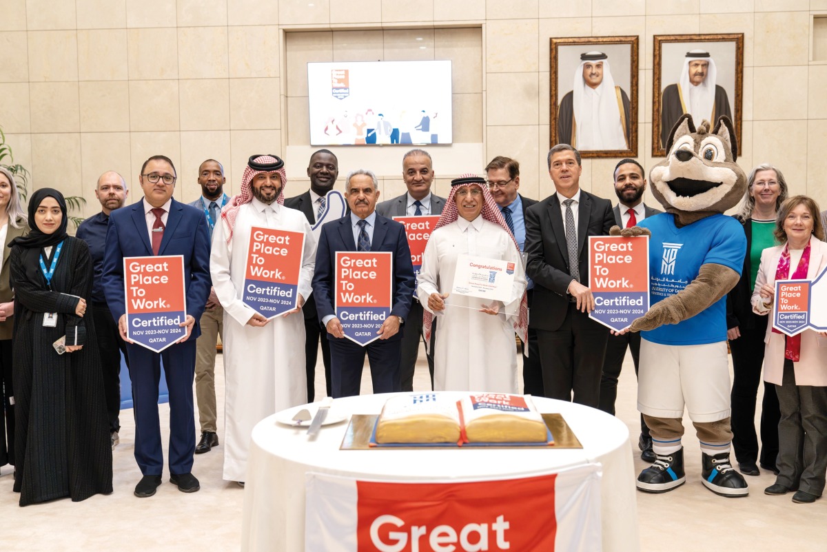 UDST President Dr. Salem Al Naemi (centre) and other officials gather to mark the achievement. 