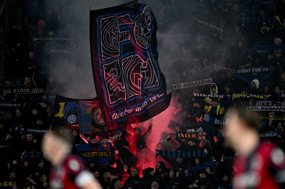 Inter Milan' supporters cheers during the Italian Serie A football match between Bologna and Inter Milan at the Renato-Dall'Ara stadium in Bologna on March 9, 2024. (Photo by Gabriel BOUYS / AFP)
