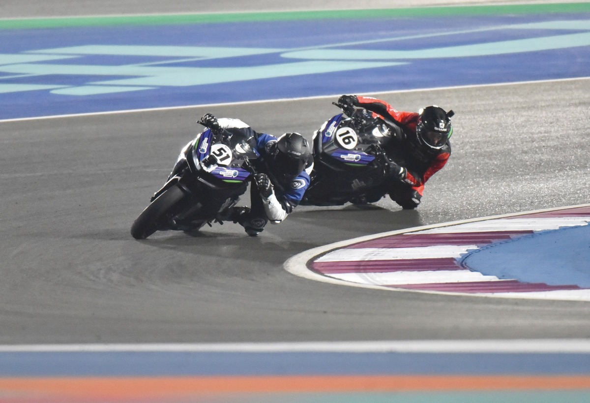 British rider Aaron Robinson (left) and Italy's Ediardo Pia in action during the Qatar Super Sports 300 Race.