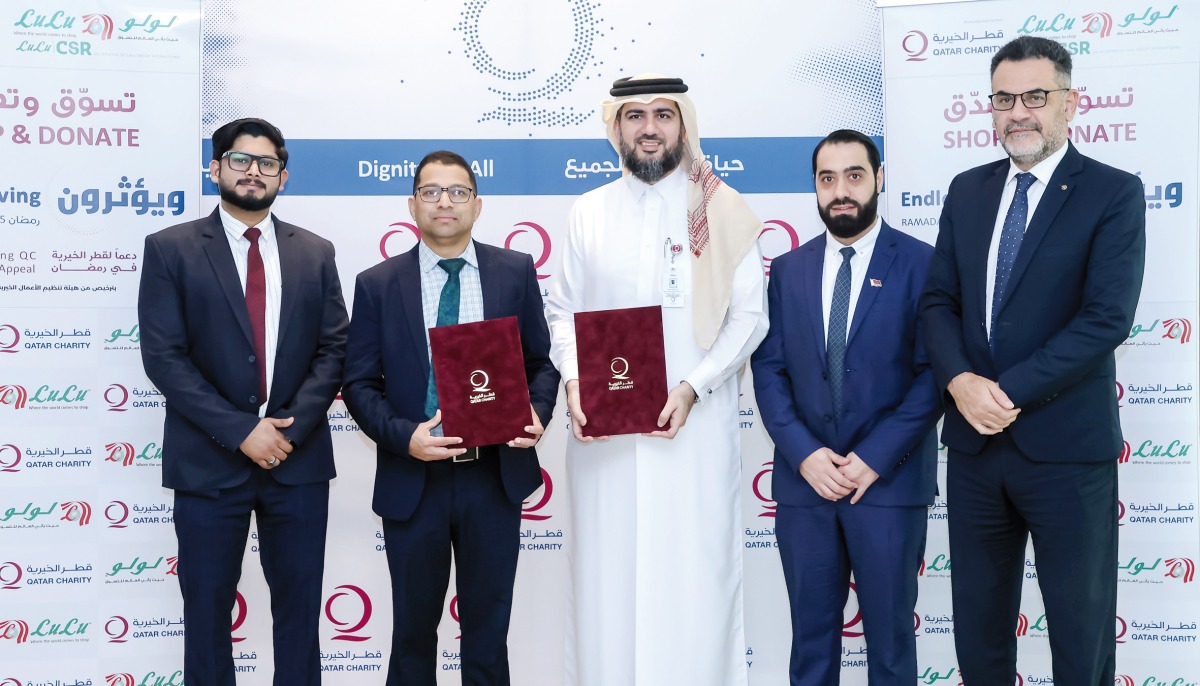 Qatar Charity and Lulu Hypermarket officials during the agreement signing in Doha recently.
