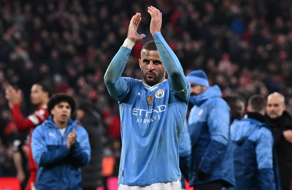 Manchester City's English defender #02 Kyle Walker (C) applauds the fans following during the English Premier League football match between Liverpool and Manchester City at Anfield in Liverpool, north west England on March 10, 2024. (Photo by Paul ELLIS / AFP) 
