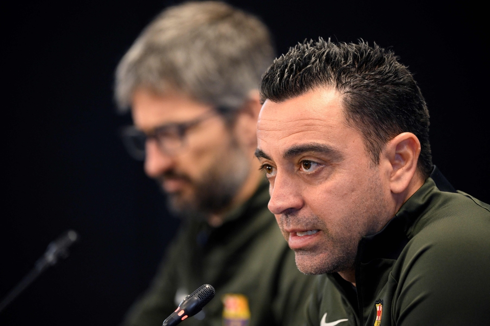 Barcelona's Spanish coach Xavi gives a press conference on the eve of their UEFA Champions League last 16 second leg football match against SSC Napoli at the training center in Barcelona on March 11, 2024. (Photo by Josep LAGO / AFP)
