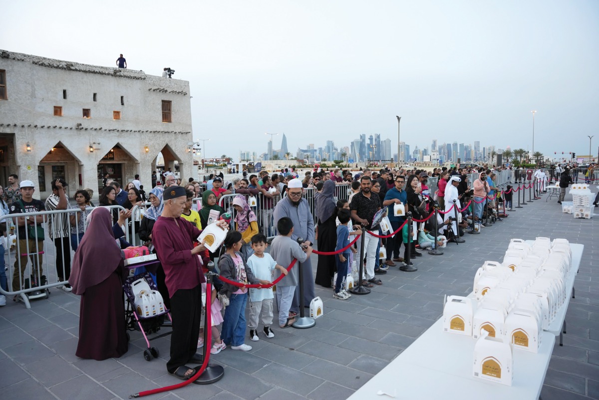 People receiving Iftaar packets as part of the Ramadan activities at Souq Waqif yesterday. PICS: Mohammed Farag