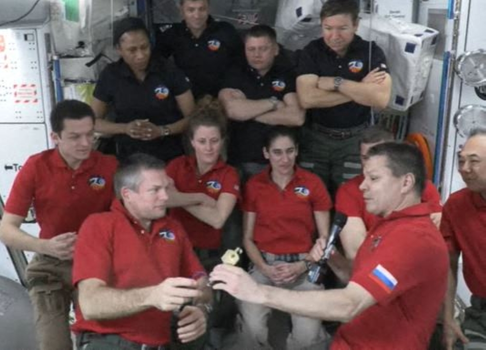 In this screen grab from NASA's feed, ESA (European Space Agency) astronaut Andy Mogensen (L) hands over command of the International space station to Roscosmos cosmonauts Oleg Kononenko as Mogensen prepares to head home with his Crew-7 crewmates. (Photo by Handout / NASA TV / AFP)