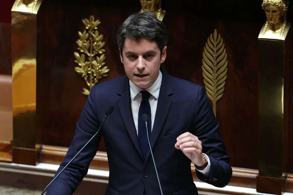 France's Prime Minister Gabriel Attal makes a statement about the situation in Ukraine prior to a debate at the National Assembly in Paris on March 12, 2024. (Photo by Thomas SAMSON / AFP)
