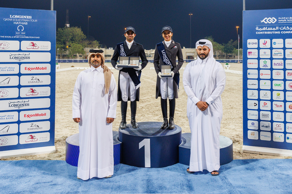 Maryam Ahmed Alsemaitt and Jassim Mohammed Al Fahd Al Kuwari pose with their awards. 