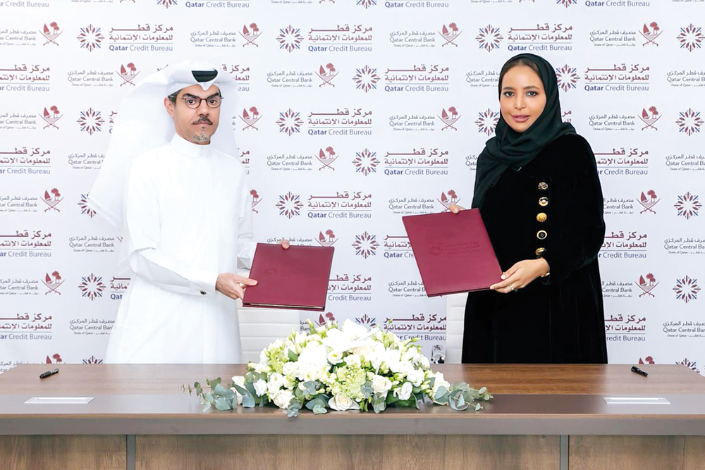 Qatar Credit Bureau CEO Sheikha Maryam bint Khalifa Al Thani and Manateq Acting CEO Engineer Mohammed Lutfalla Al Emadi during the agreement signing.