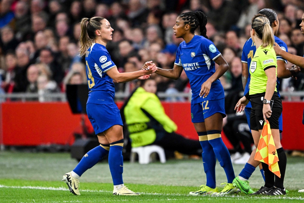 Chelsea FC Swedish midfielder #19 Johanna Rytting Kaneryd (L) and teammate Canadian defencer #12 Ashley Lawrence react during the UEFA women's Champions League quarter-final match between Ajax Amsterdam and Chelsea FC at the Johan-Cruijff ArenA on March 19, 2024 in Amsterdam. (Photo by Gerrit van Keulen / ANP / AFP)