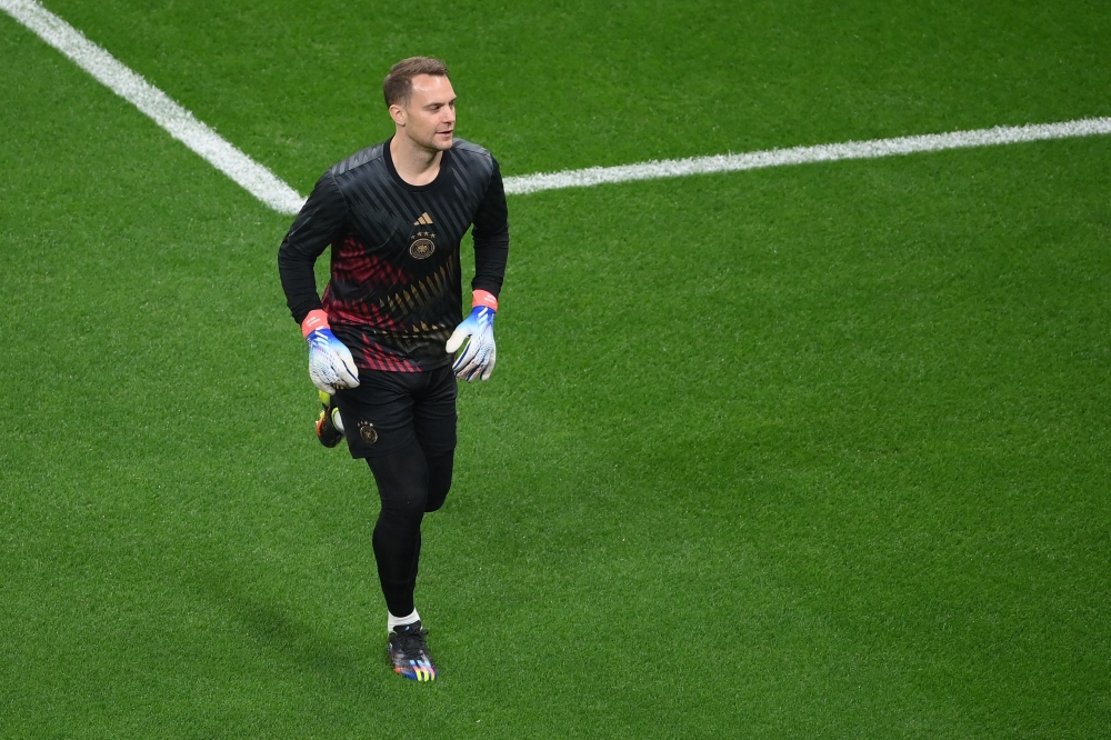 (FILES) Germany's goalkeeper #01 Manuel Neuer warms up before the Qatar 2022 World Cup Group E football match between Costa Rica and Germany at the Al-Bayt Stadium in Al Khor, north of Doha on December 1, 2022. (Photo by FRANCK FIFE / AFP)
